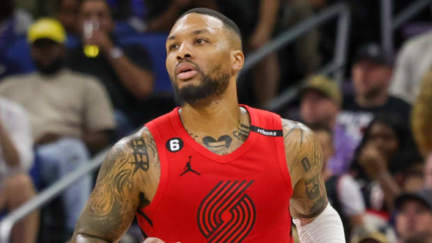 Trail Blazers guard Damian Lillard dribbles the ball.